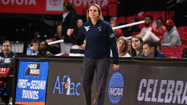 COLLEGE PARK, MD - MARCH 17: Dawn Plitzuweit Head Coach of the West Virginia Mountaineers instructs her team in the first half of the first round of the 2023 NCAA Women's Basketball Tournament held at the Xfinity Center on March 17, 2023 in College Park, Maryland.