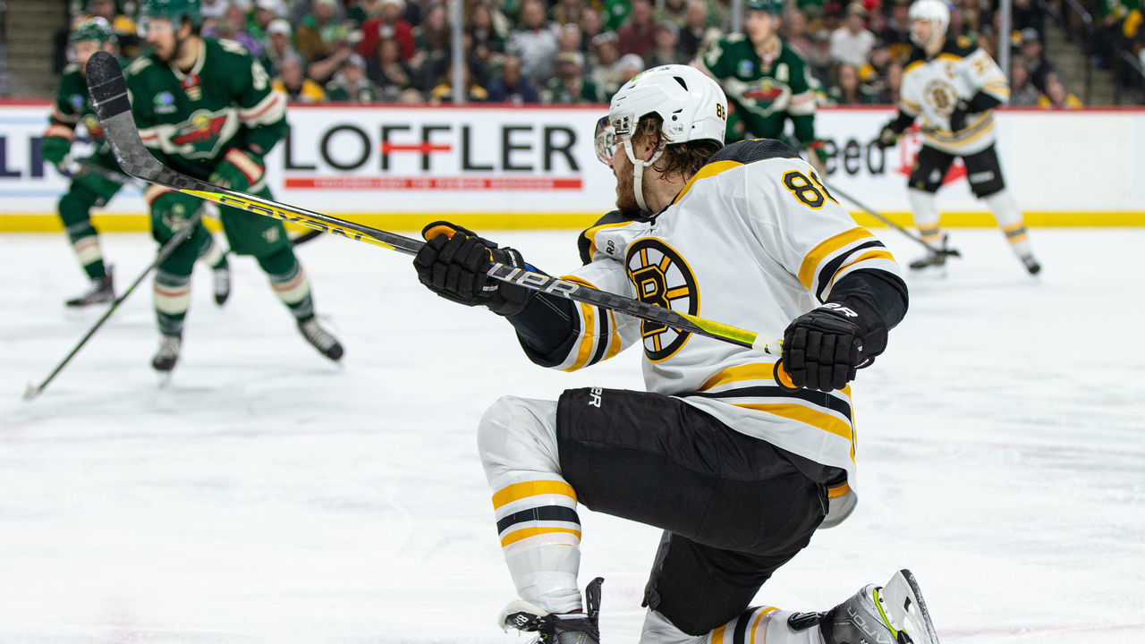SAINT PAUL, MN - MARCH 18: Boston Bruins right wing David Pastrnak (88) shoots the puck during the NHL game between the Boston Bruins and Minnesota Wild, on March 18th, 2023, at the Xcel Energy Center in Saint Paul, MN.
