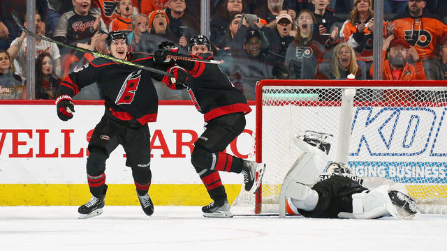 PHILADELPHIA, PENNSYLVANIA - MARCH 18: Martin Necas #88 and Sebastian Aho #20 of the Carolina Hurricanes react after Necas scored the game-tying goal against Felix Sandstrom #32 of the Philadelphia Flyers with less than a second remaining in regulation time at the Wells Fargo Center on March 18, 2023 in Philadelphia, Pennsylvania. The Hurricanes went on to defeat the Flyers in overtime 5-4.
