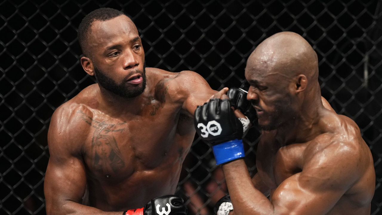 LONDON, ENGLAND - MARCH 18: (L-R) Leon Edwards of Jamaica punches Kamaru Usman of Nigeria in a lightweight fight during the UFC 286 event at The O2 Arena on March 18, 2023 in London, England.
