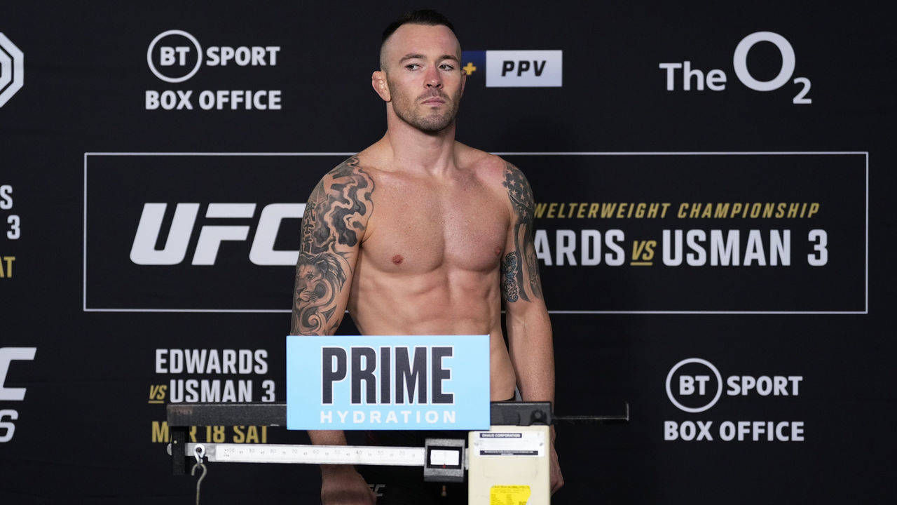 LONDON, ENGLAND - MARCH 17: Colby Covington poses on the scale during the UFC 286 official weigh-in at Hilton London Canary Wharf on March 17, 2023 in London, England.