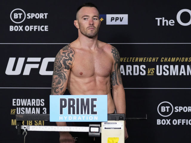 LONDON, ENGLAND - MARCH 17: Colby Covington poses on the scale during the UFC 286 official weigh-in at Hilton London Canary Wharf on March 17, 2023 in London, England.