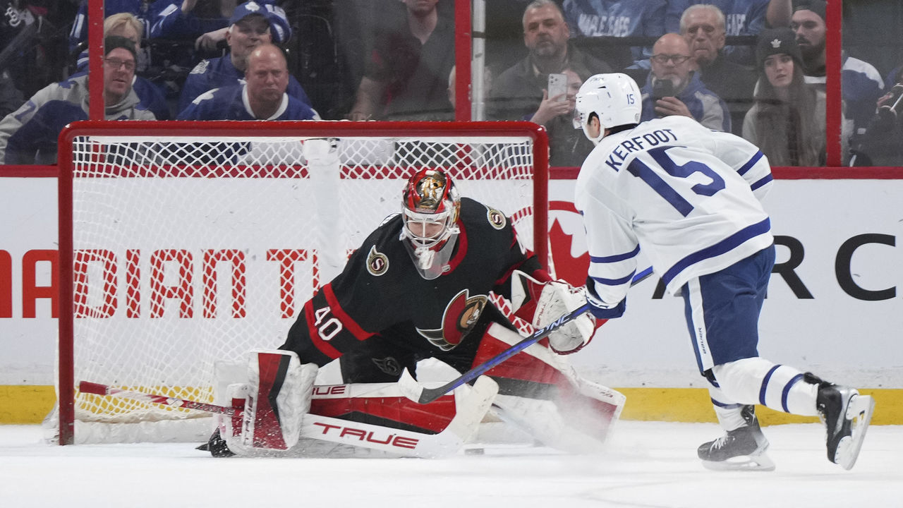 OTTAWA, CANADA - MARCH 18: Alexander Kerfoot #15 of the Toronto Maple Leafs scores the shootout winning goal against Mads Sogaard #40 of the Ottawa Senators at Canadian Tire Centre on March 18, 2023 in Ottawa, Ontario, Canada.