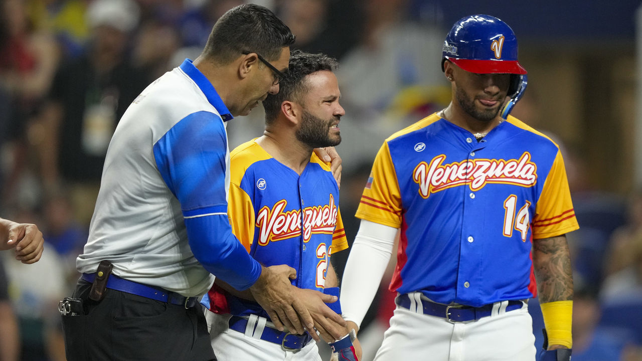 MIAMI, FLORIDA - MARCH 18: Jose Altuve #27 of Venezuela walks towards the dugout after being hit by a pitch during the fifth inning during a 2023 World Baseball Classic Quarterfinal game against the United States at loanDepot park on March 18, 2023 in Miami, Florida.