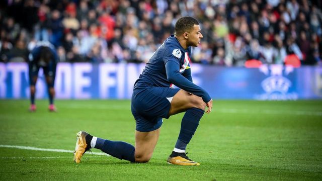 Paris Saint-Germain's French forward Kylian Mbappe reacts during the French L1 football match between Paris Saint-Germain (PSG) and Stade Rennais FC at The Parc des Princes Stadium in Paris on March 19, 2023.