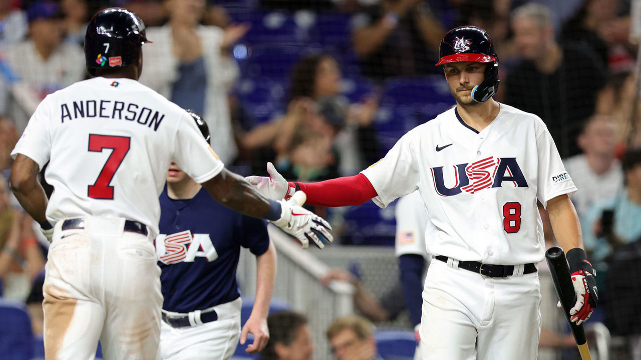 MIAMI, FLORIDA - MARCH 19: Trea Turner #8 of Team USA greets Tim Anderson #7 at home plate in the third inning against Team Cuba during the World Baseball Classic Semifinals at loanDepot park on March 19, 2023 in Miami, Florida.