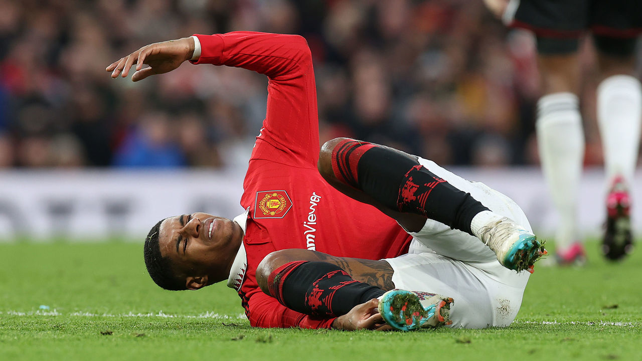 MANCHESTER, ENGLAND - MARCH 19: Marcus Rashford of Manchester United lies injured during the Emirates FA Cup Quarter-Final match between Manchester United and Fulham at Old Trafford on March 19, 2023 in Manchester, England.