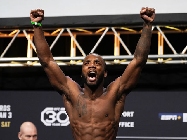 LONDON, ENGLAND - MARCH 17: Leon Edwards of Jamaica poses on the scale during the UFC 286 ceremonial weigh-in at The O2 Arena on March 17, 2023 in London, England.