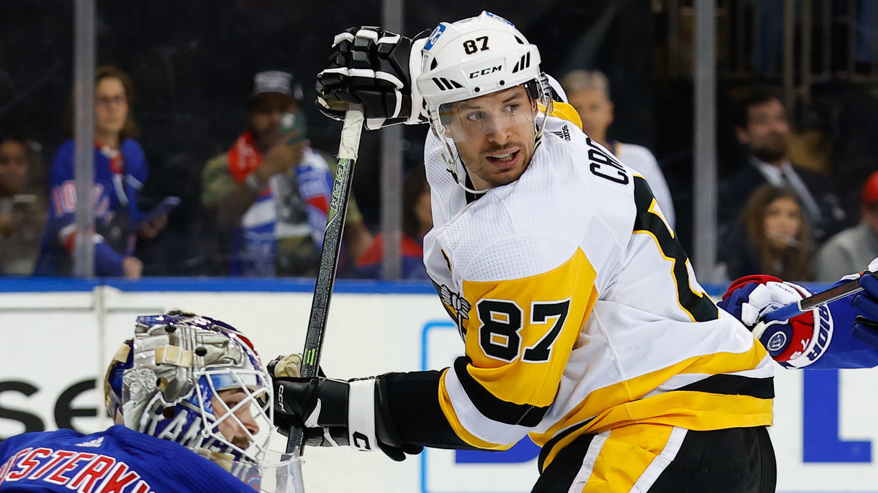 NEW YORK, NY - MARCH 18: Sidney Crosby #87 of the Pittsburgh Penguins in front of Igor Shesterkin #31 of the New York Rangers on March 18, 2023 at Madison Square Garden in New York, New York.