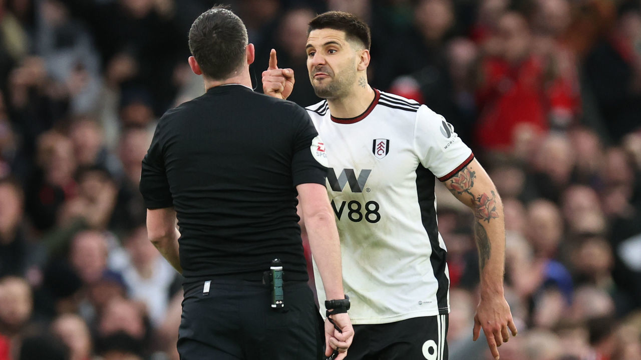 MANCHESTER, ENGLAND - MARCH 19: Aleksandar Mitrovic of Fulham receives a red card from Referee Chris Kavanagh during the Emirates FA Cup Quarter Final match between Manchester United and Fulham at Old Trafford on March 19, 2023 in Manchester, England.
