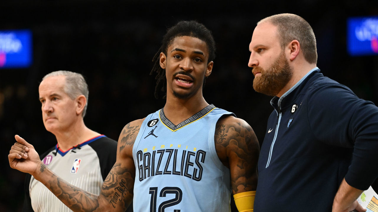 BOSTON, MASSACHUSETTS - FEBRUARY 12: Ja Morant #12 of the Memphis Grizzlies talks with Taylor Jenkins during the fourth quarter of a game against the Boston Celtics at TD Garden on February 12, 2023 in Boston, Massachusetts.