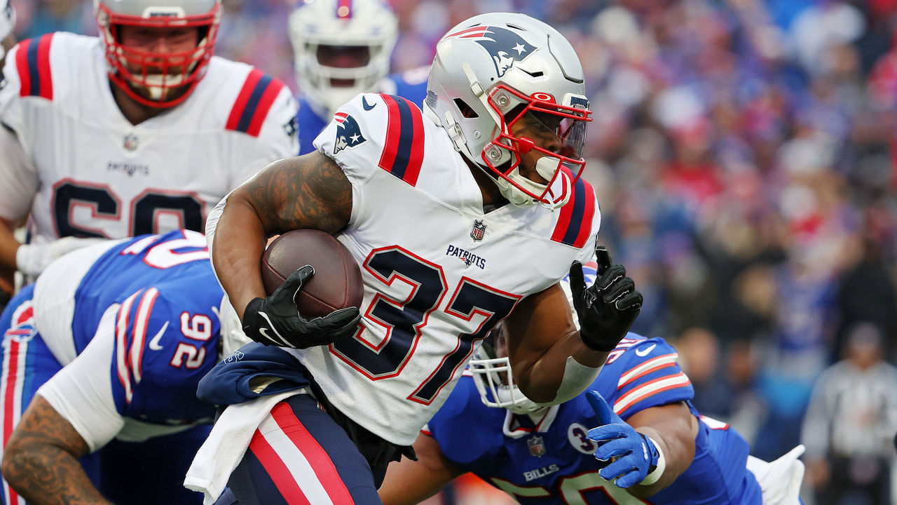 ORCHARD PARK, NEW YORK - JANUARY 08: Damien Harris #37 of the New England Patriots runs the ball during the first quarter against the Buffalo Bills at Highmark Stadium on January 08, 2023 in Orchard Park, New York.