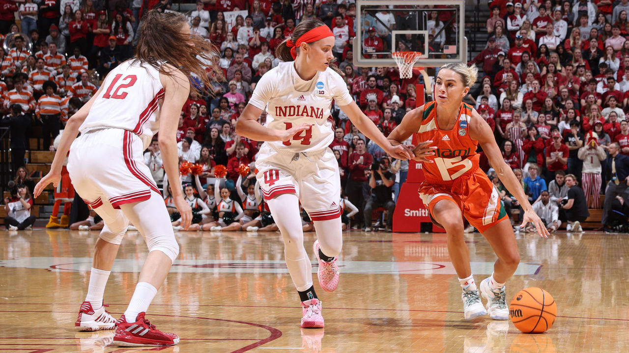 BLOOMINGTON, IN - MARCH 20: Hanna Cavinder #15 of the Miami Hurricanes drives to the basket against Sara Scalia #14 of the Indiana Hoosiers during the second round of the 2023 NCAA Women's Basketball Tournament held at Simon Skjodt Assembly Hall on March 20, 2023 in Bloomington, Indiana.