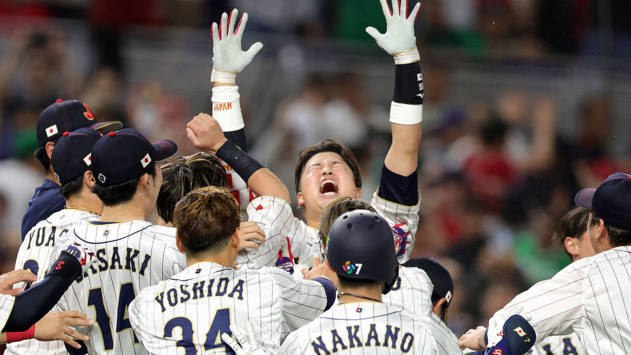 MIAMI, FLORIDA - MARCH 20: Munetaka Murakami #55 of Team Japan celebrates with teammates after hitting a two-run double to defeat Team Mexico 6-5 in the World Baseball Classic Semifinals at loanDepot park on March 20, 2023 in Miami, Florida.