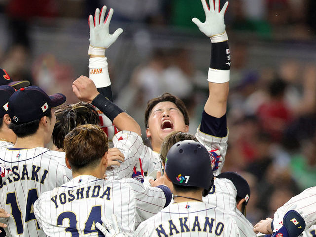 MIAMI, FLORIDA - MARCH 20: Munetaka Murakami #55 of Team Japan celebrates with teammates after hitting a two-run double to defeat Team Mexico 6-5 in the World Baseball Classic Semifinals at loanDepot park on March 20, 2023 in Miami, Florida.