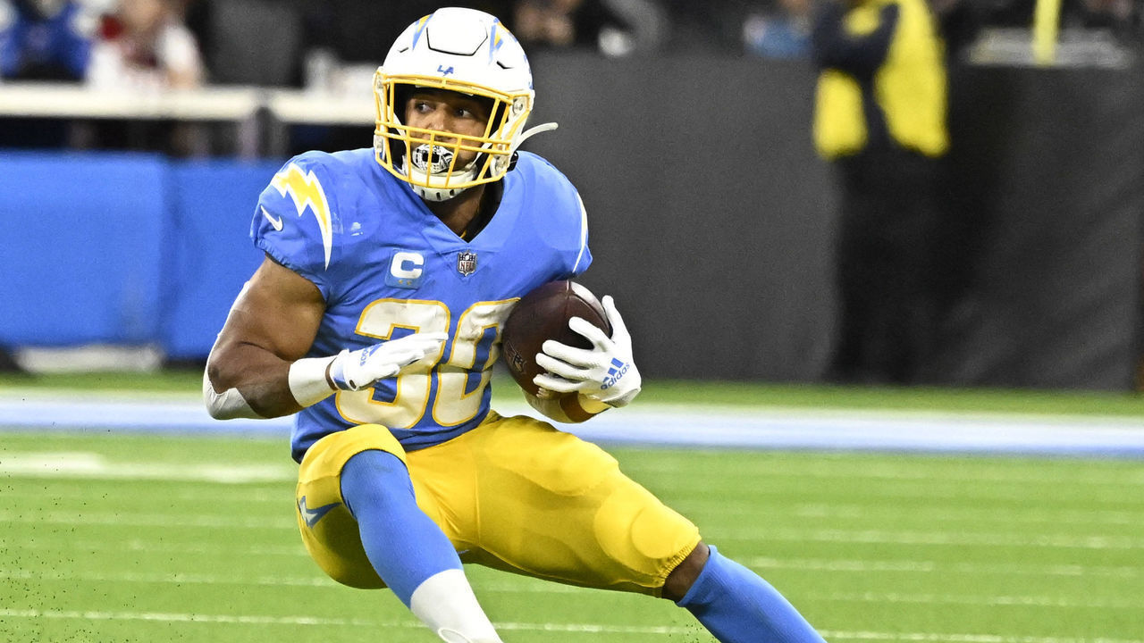 Inglewood, CA - December 11: running back Austin Ekeler #30 of the Los Angeles Chargers runs for first down against the Miami Dolphins in the first half of a NFL football game at SoFi Stadium in Inglewood on Sunday, December 11, 2022.