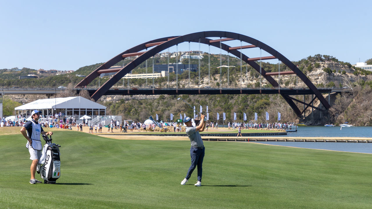 AUSTIN, TX - MARCH 26: Seamus Power hits his approach shot on the 13th hole with the Pennybacker Bridge in the background during the Quarterfinals of the PGA - World Golf Championships-Dell Technologies Match Play on March 26, 2022, at Austin County Club in Austin, TX.