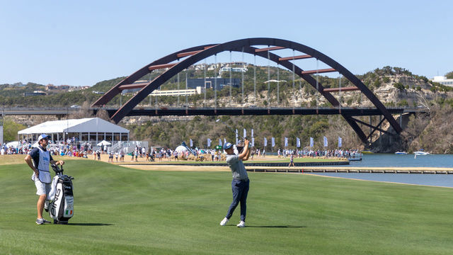 AUSTIN, TX - MARCH 26: Seamus Power hits his approach shot on the 13th hole with the Pennybacker Bridge in the background during the Quarterfinals of the PGA - World Golf Championships-Dell Technologies Match Play on March 26, 2022, at Austin County Club in Austin, TX.