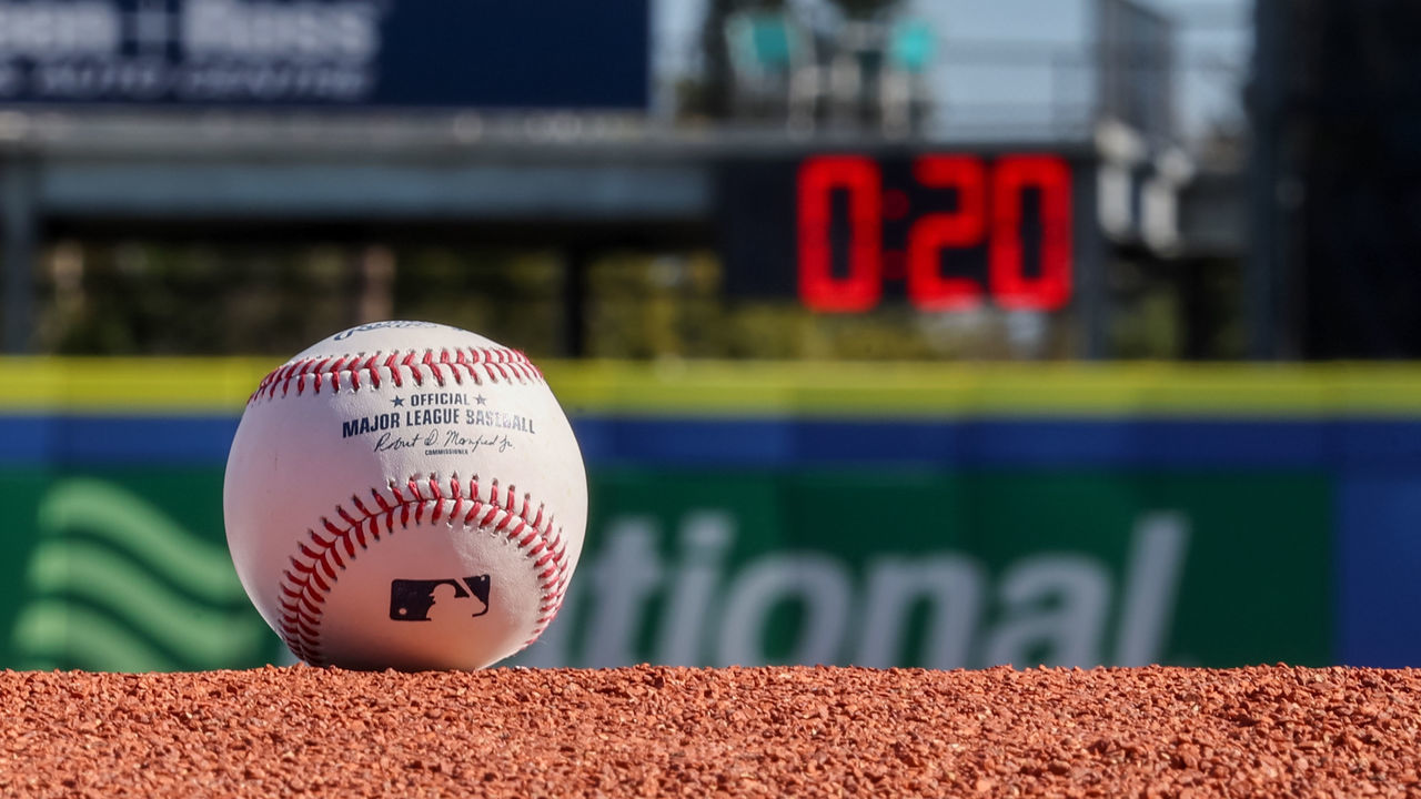 DUNEDIN, FL - FEBRUARY 15: A detail shot of an Official Rawlings baseball on the field with a pitch clock in the background as new rule changes are demonstrated to assembled media during the On-Field Rules Demonstration at TD Ballpark on Wednesday, February 15, 2023 in Dunedin, Florida.