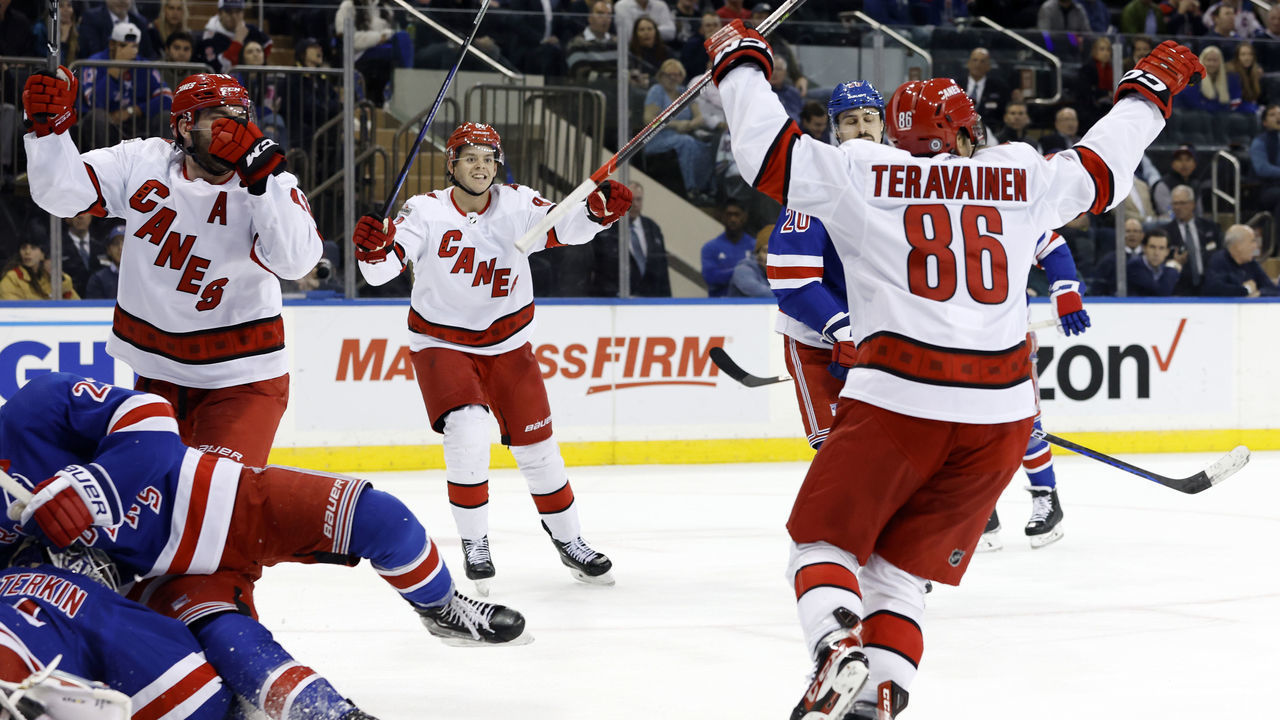 NEW YORK, NEW YORK - MARCH 21: Jesperi Kotkaniemi #82 reacts with Teuvo Teravainen #86 of the Carolina Hurricanes after Teravainen's game-winning goal during the third period against the New York Rangers at Madison Square Garden on March 21, 2023 in New York City. The Hurricanes won 3-2.