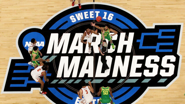 INDIANAPOLIS, INDIANA - MARCH 28: Evan Mobley #4 of the USC Trojans and LJ Figueroa #12 of the Oregon Ducks jump for the opening tip off in the Sweet Sixteen round of the 2021 NCAA Men's Basketball Tournament at Bankers Life Fieldhouse on March 28, 2021 in Indianapolis, Indiana.