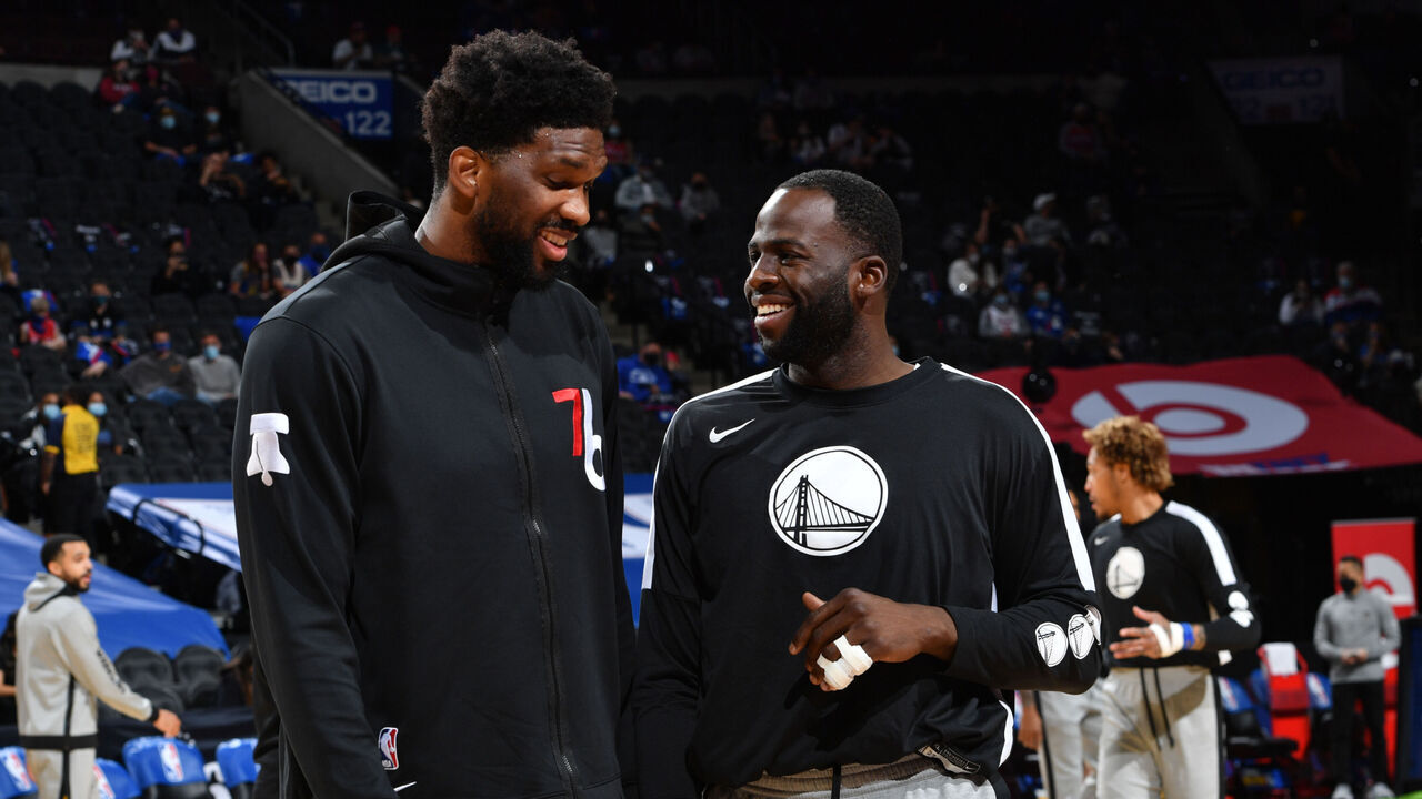PHILADELPHIA, PA - APRIL 19: Joel Embiid #21 of the Philadelphia 76ers and Draymond Green #23 of the Golden State Warriors talk prior to a game on April 19, 2021 at Wells Fargo Center in Philadelphia, Pennsylvania. NOTE TO USER: User expressly acknowledges and agrees that, by downloading and/or using this Photograph, user is consenting to the terms and conditions of the Getty Images License Agreement. Mandatory Copyright Notice: Copyright 2021 NBAE