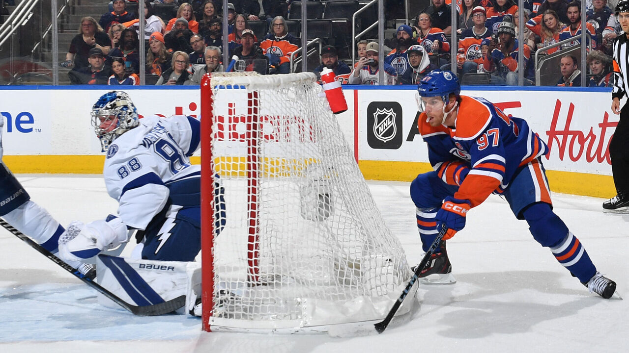 EDMONTON, CANADA - JANUARY 19: Connor McDavid #97 of the Edmonton Oilers skates with the puck around the net during the game against the Tampa Bay Lightning on January 19, 2023 at Rogers Place in Edmonton, Alberta, Canada.