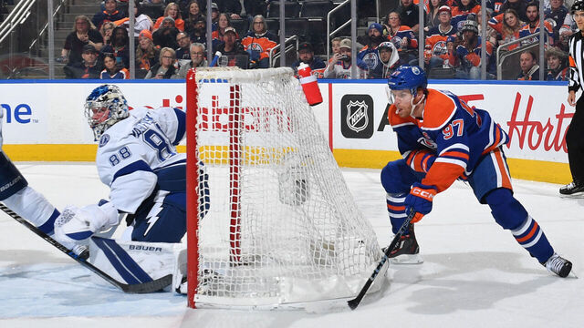 EDMONTON, CANADA - JANUARY 19: Connor McDavid #97 of the Edmonton Oilers skates with the puck around the net during the game against the Tampa Bay Lightning on January 19, 2023 at Rogers Place in Edmonton, Alberta, Canada.