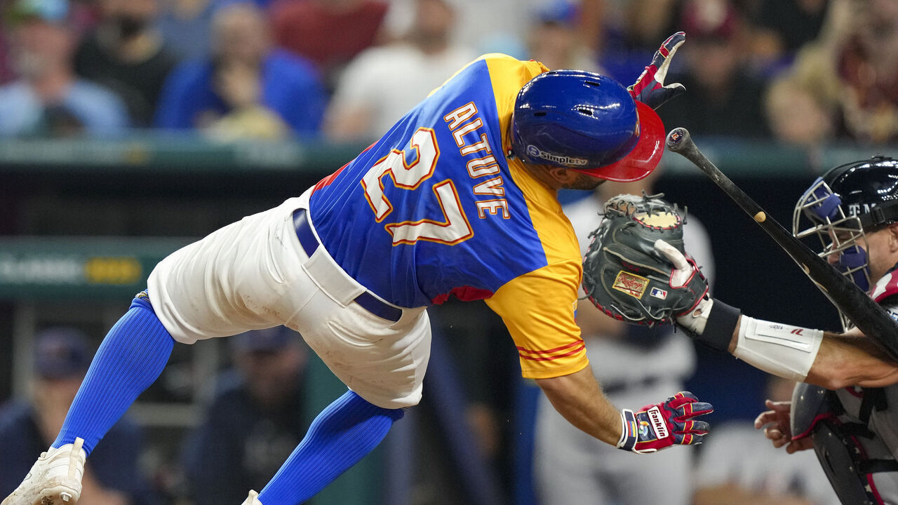 MIAMI, FLORIDA - MARCH 18: Jose Altuve #27 of Venezuela is hit by a pitch during the fifth inning during a 2023 World Baseball Classic Quarterfinal game against the United States at loanDepot park on March 18, 2023 in Miami, Florida.