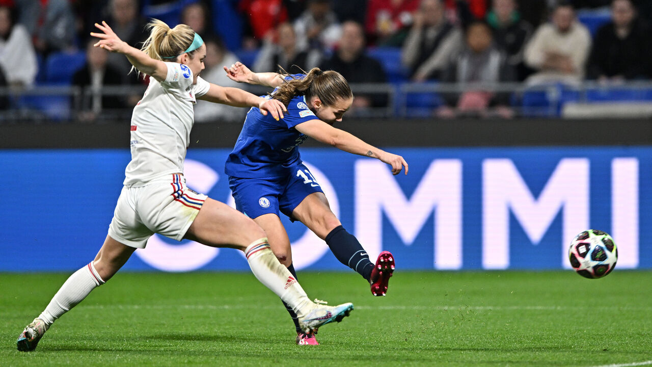 LYON, FRANCE - MARCH 22: Guro Reiten of Chelsea shoots whilst under pressure from Ellie Carpenter of Olympique Lyonnais during the UEFA Women's Champions League Quarter-Final 1st Leg match between Olympique Lyonnais and Chelsea FC at Groupama Stadium on March 22, 2023 in Lyon, France.