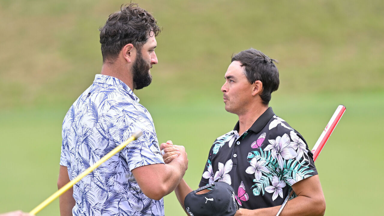 AUSTIN, TEXAS - MARCH 22: Rickie Fowler and Jon Rahm of Spain shake hands on the 17th green during the first day of the World Golf Championships-Dell Technologies Match Play at Austin Country Club on March 22, 2023 in Austin, Texas.