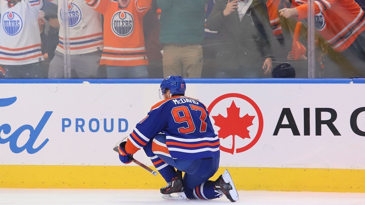 EDMONTON, CANADA - MARCH 22: Connor McDavid #97 of the Edmonton Oilers celebrates a goal in overtime against the Arizona Coyotes at Rogers Place on March 22, 2023 in Edmonton, Alberta, Canada. The goal is his 60th of the season.