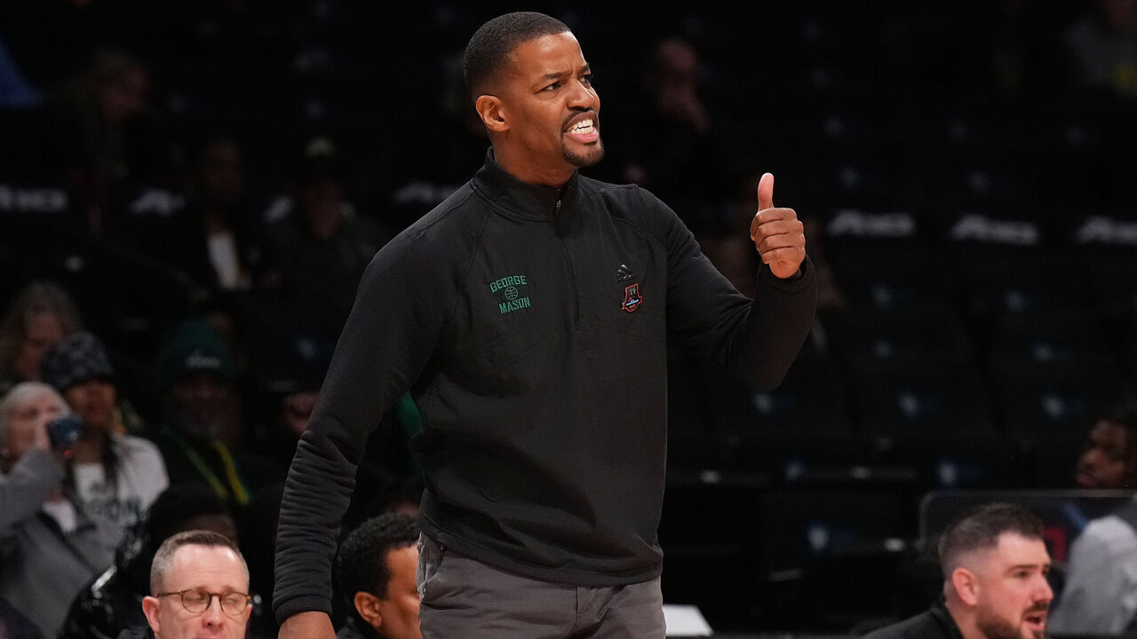 NEW YORK, NEW YORK - MARCH 08: Head coach Kim English of the George Mason Patriots yells out from the bench against the Richmond Spiders in the first half during the Second Round of the A10 Basketball Tournament at Barclays Center on March 08, 2023 in Brooklyn, New York.