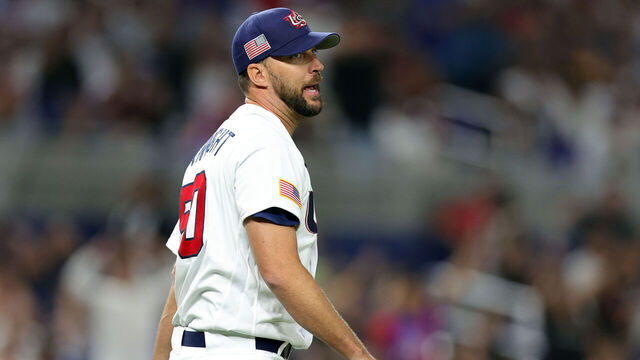MIAMI, FLORIDA - MARCH 19: Adam Wainwright #50 of Team USA reacts after missing a throw to first base against Team Cuba in the third inning during the World Baseball Classic Semifinals at loanDepot park on March 19, 2023 in Miami, Florida.