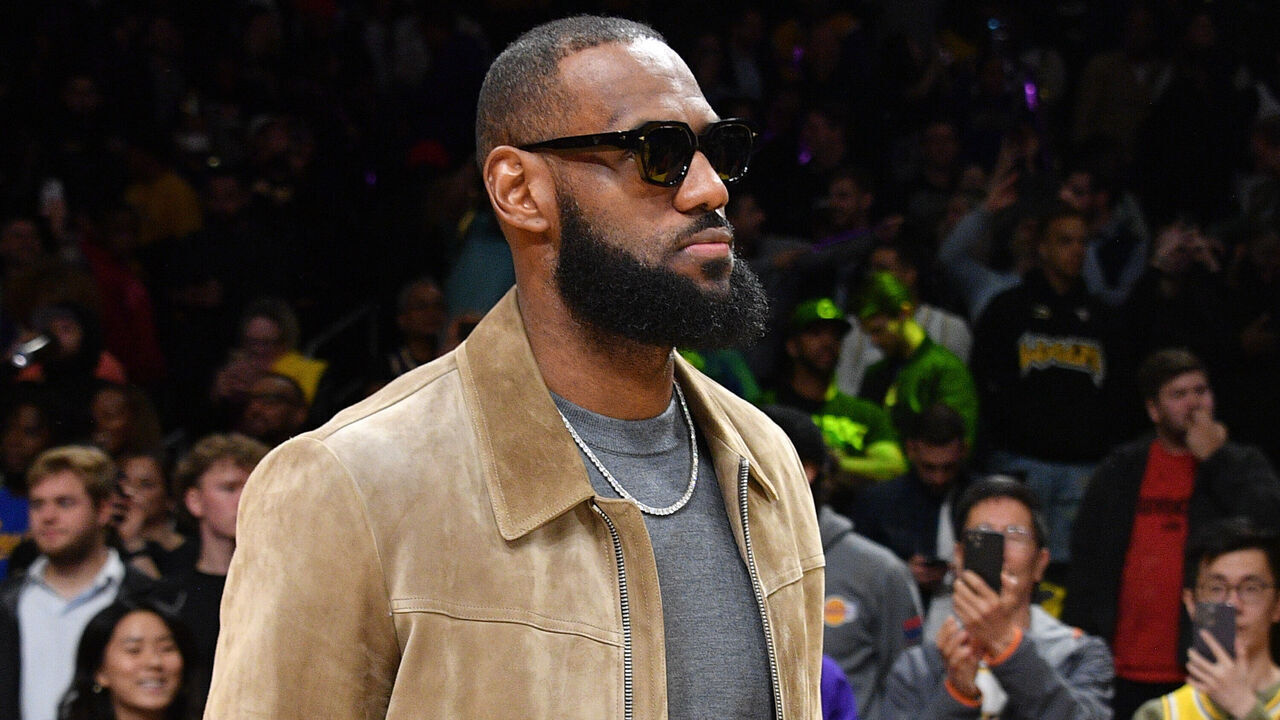 LOS ANGELES, CALIFORNIA - MARCH 22: Injured LeBron James watches a basketball game between the Los Angeles Lakers and the Phoenix Suns at Crypto.com Arena on March 22, 2023 in Los Angeles, California.