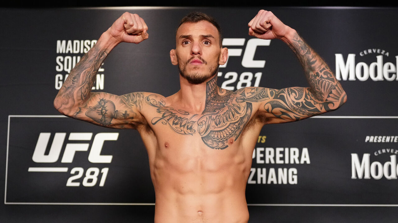 NEW YORK, NEW YORK - NOVEMBER 11: Renato Moicano of Brazil poses on the scale during the UFC 281 official weigh-in at the Marriott Marquis Hotel on November 11, 2022 in New York City.