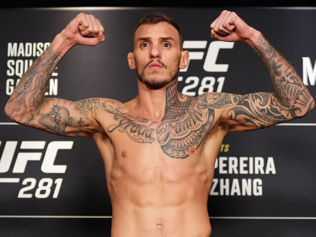 NEW YORK, NEW YORK - NOVEMBER 11: Renato Moicano of Brazil poses on the scale during the UFC 281 official weigh-in at the Marriott Marquis Hotel on November 11, 2022 in New York City.