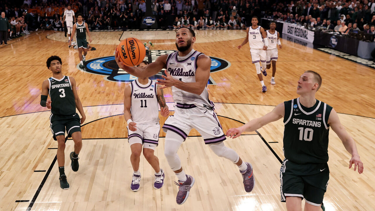 NEW YORK, NEW YORK - MARCH 23: Markquis Nowell #1 of the Kansas State Wildcats shoots the ball against Joey Hauser #10 of the Michigan State Spartans during overtime in the Sweet 16 round game of the NCAA Men's Basketball Tournament at Madison Square Garden on March 23, 2023 in New York City.