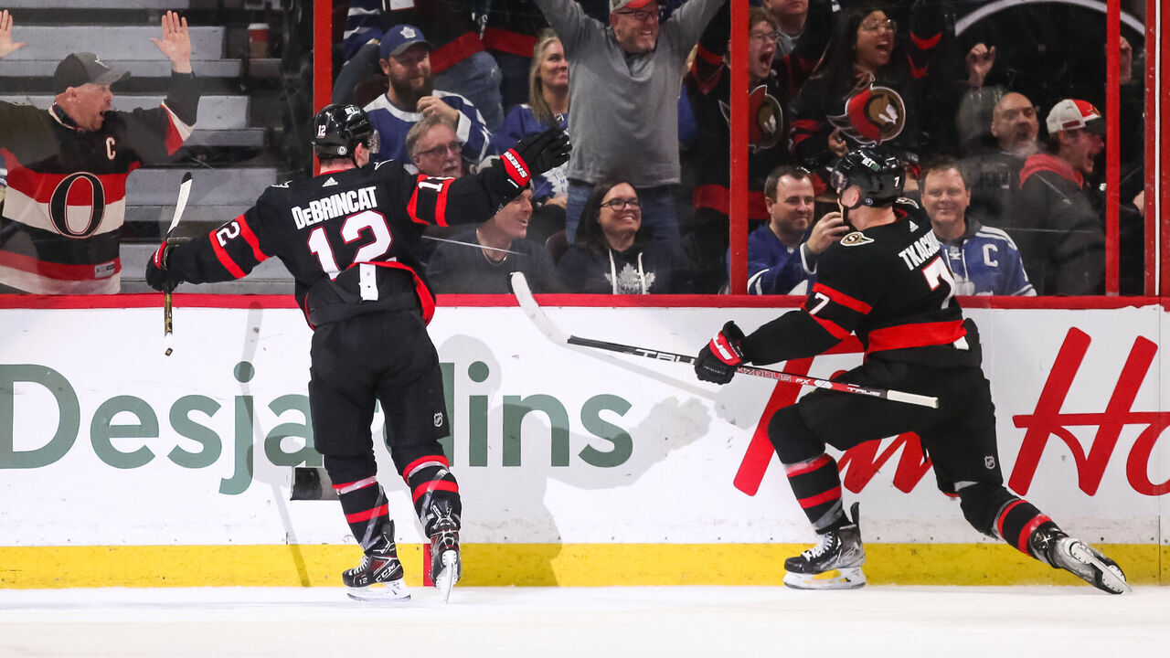 OTTAWA, CANADA - MARCH 18: Brady Tkachuk #7 of the Ottawa Senators celebrates his third period goal with his teammate Alex DeBrincat #12 during the game against the Toronto Maple Leafs at Canadian Tire Centre on March 18, 2023 in Ottawa, Ontario, Canada.
