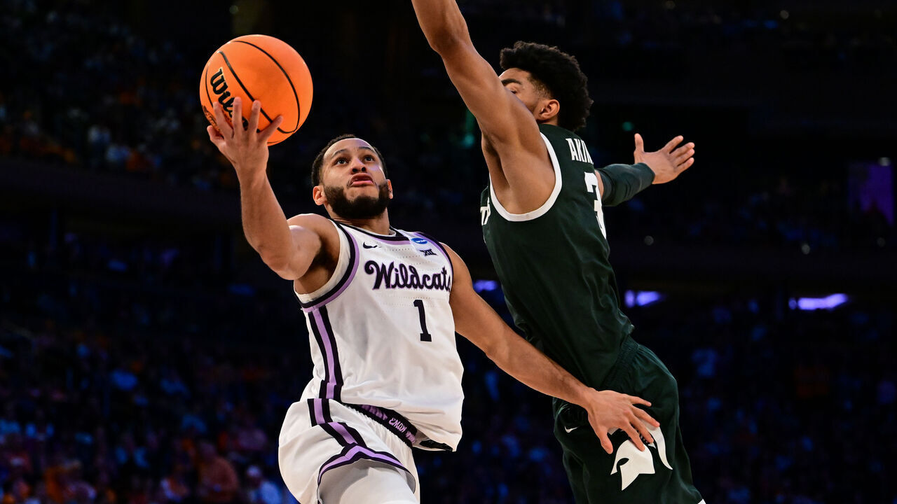 NEW YORK, NEW YORK - MARCH 23: Markquis Nowell #1 of the Kansas State Wildcats goes up for a layup guarded by Jaden Akins #3 of the Michigan State Spartans during overtime of the game during the Sweet Sixteen round of the 2023 NCAA Men's Basketball Tournament held at Madison Square Garden on March 23, 2023 in New York City.
