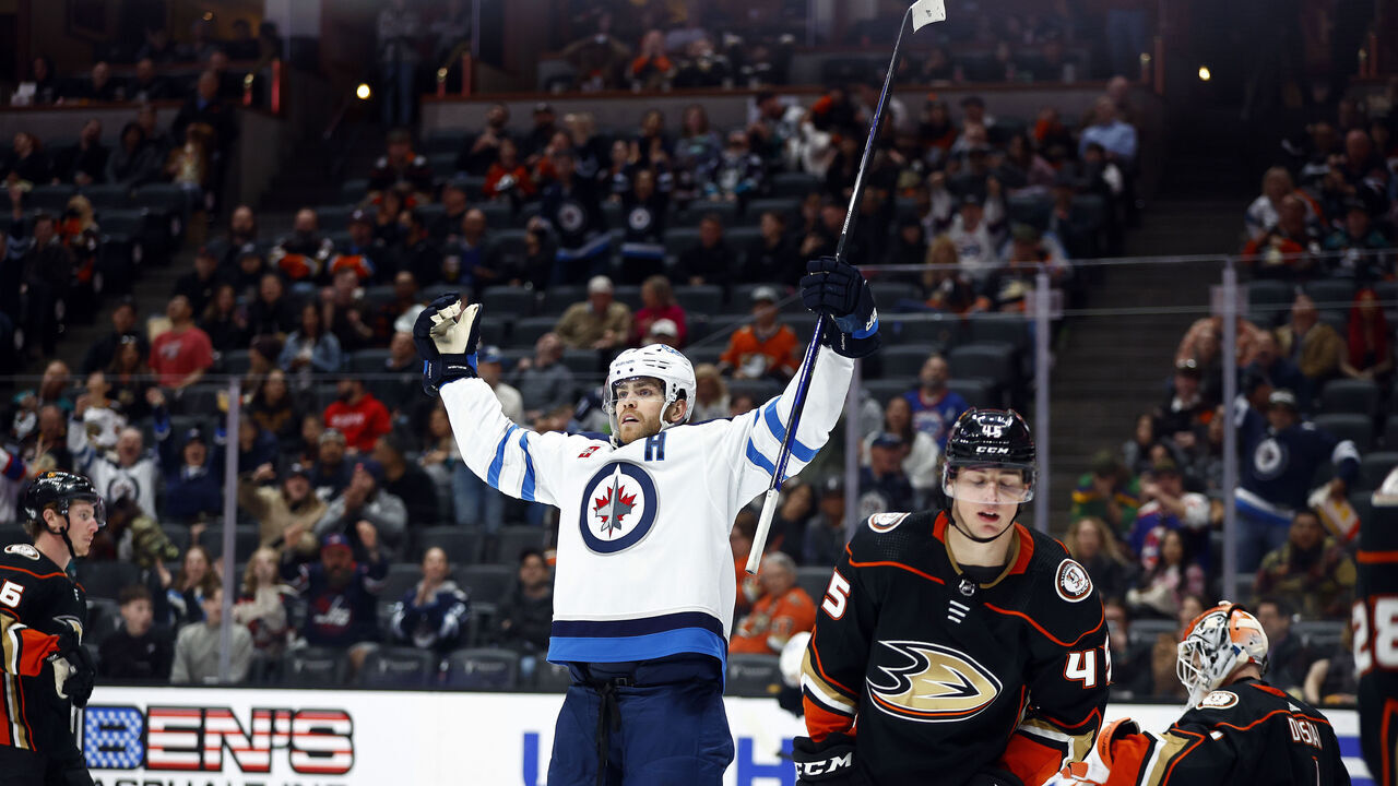 ANAHEIM, CALIFORNIA - MARCH 23: Adam Lowry #17 of the Winnipeg Jets celebrates a goal against the Anaheim Ducks in the third period at Honda Center on March 23, 2023 in Anaheim, California.