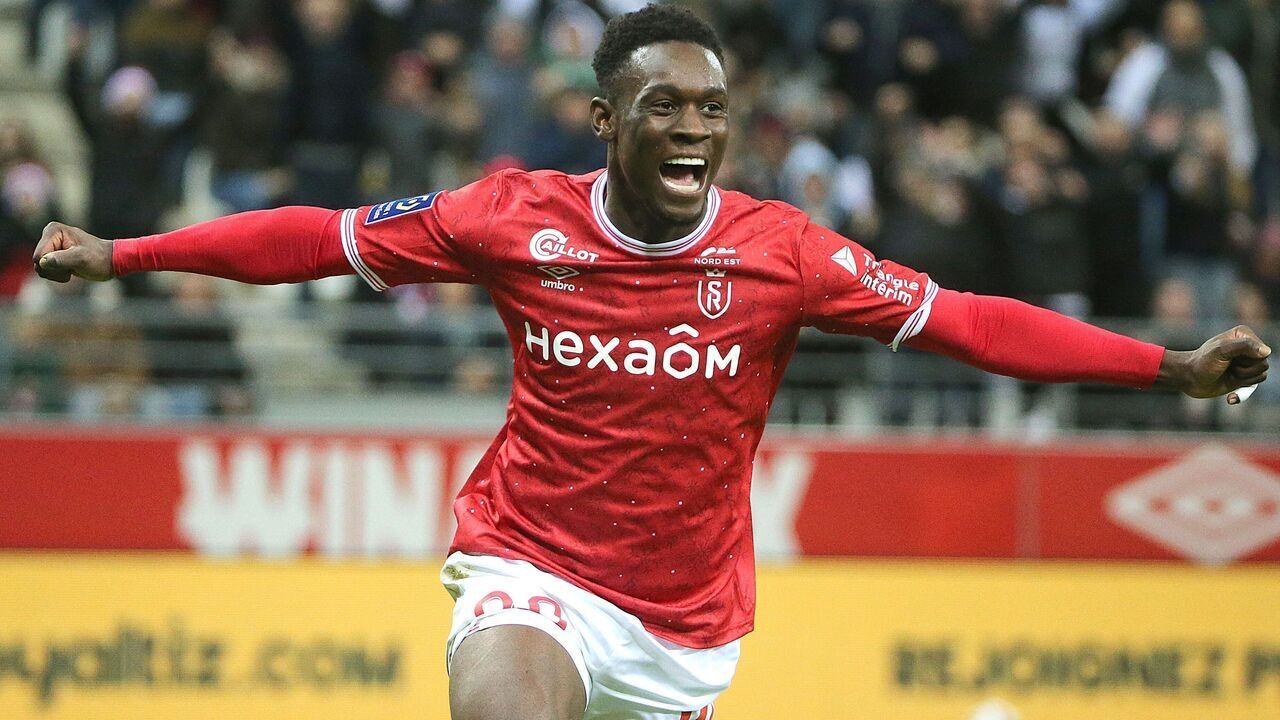 Reims' English forward Folarin Balogun celebrates scoring a goal during the French L1 football match between Stade de Reims and Stade Rennais FC at the Auguste-Delaune II stadium in Reims on December 29, 2022.