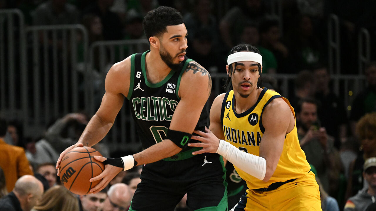 BOSTON, MASSACHUSETTS - MARCH 24: Jayson Tatum #0 of the Boston Celtics goes to the basket against Andrew Nembhard #2 of the Indiana Pacers during the first quarter at the TD Garden on March 24, 2023 in Boston, Massachusetts.