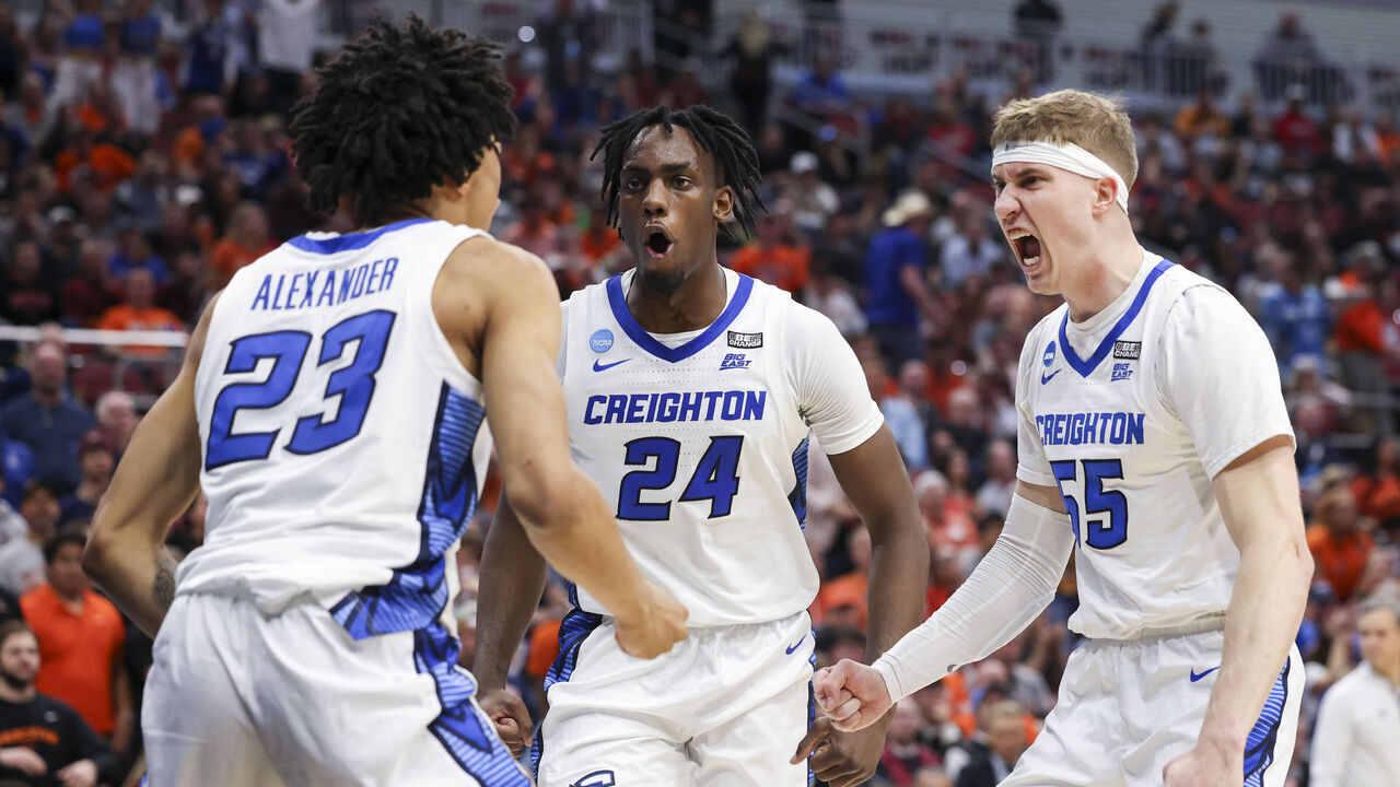 LOUISVILLE, KY - MARCH 24: Baylor Scheierman #55 of the Creighton Bluejays and Arthur Kaluma #24 of the Creighton Bluejays celebrate with Trey Alexander #23 of the Creighton Bluejays after he scored against the Princeton Tigers during the Sweet Sixteen round of the 2022 NCAA Men's Basketball Tournament held at KFC YUM! Center on March 24, 2023 in Louisville, Kentucky.