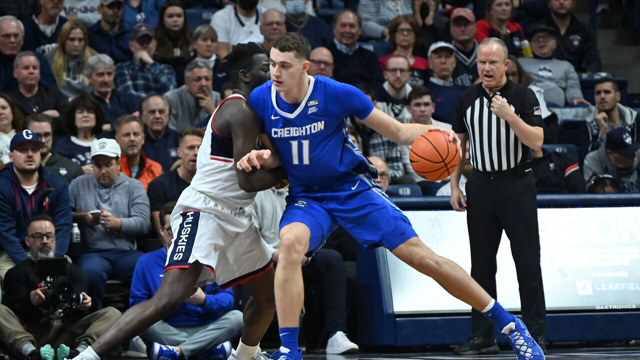STORRS, CT - JANUARY 07: Creighton Bluejays center Ryan Kalkbrenner (11) works his way into the post while defended by UConn Huskies forward Adama Sanogo (21) during the game as the Creighton Bluejays take on the UConn Huskies on January 7, 2022, at the Gampel Pavilion in Storrs, Connecticut.