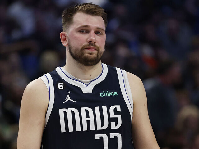 DALLAS, TEXAS - MARCH 22: Luka Doncic #77 of the Dallas Mavericks reacts on the court in the second half against the Golden State Warriors at American Airlines Center on March 22, 2023 in Dallas, Texas.
