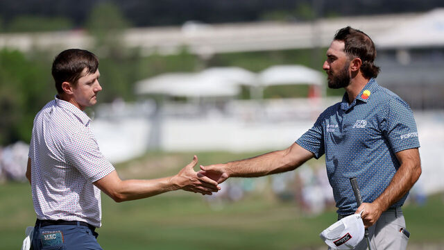 AUSTIN, TEXAS - MARCH 25: Mackenzie Hughes of Canada (L) and Max Homa of the United States shake hands on the 16th green after Hughes won their match 3 & 2 during day four of the World Golf Championships-Dell Technologies Match Play at Austin Country Club on March 25, 2023 in Austin, Texas.