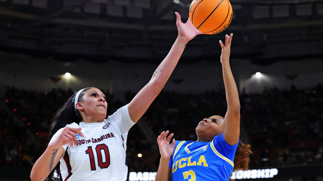 GREENVILLE, SOUTH CAROLINA - MARCH 25: Kamilla Cardoso #10 of the South Carolina Gamecocks blocks the shot of Londynn Jones #3 of the UCLA Bruins during the first half in the Sweet 16 round of the NCAA Women's Basketball Tournament at Bon Secours Wellness Arena on March 25, 2023 in Greenville, South Carolina.