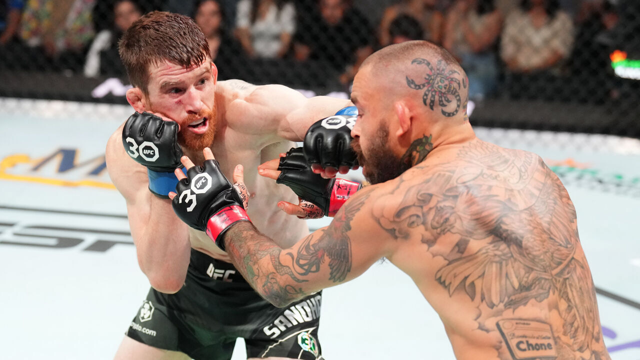 SAN ANTONIO, TEXAS - MARCH 25: (L-R) Cory Sandhagen punches Marlon Vera of Ecuador in a bantamweight fight during the UFC Fight Night event at AT&T Center on March 25, 2023 in San Antonio, Texas.