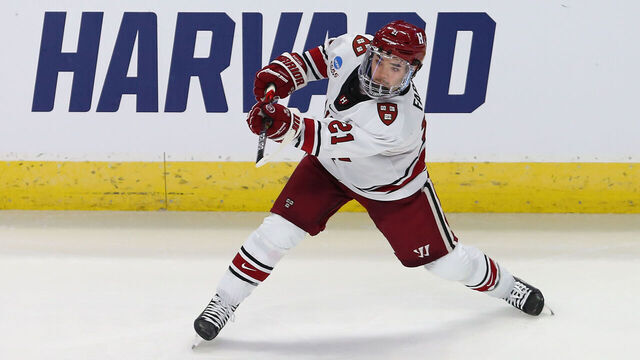 BRIDGEPORT, CT - MARCH 24: Harvard Crimson forward Sean Farrell (21) takes a shot on goal during the NCAA Division 1 Men's Regional Hockey Championship game between Ohio State Buckeyes and Harvard Crimson on March 24, 2023, at Total Mortgage Arena in Bridgeport, CT.